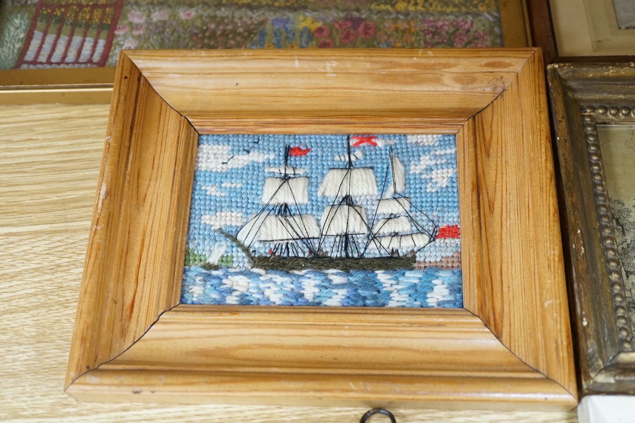 From the Studio of Fred Cuming. Six needlework embroideries including an alphabet sampler, Study of oak leaves, and 19th century landscapes, largest 23 x 29. Condition - varies, poor to fair